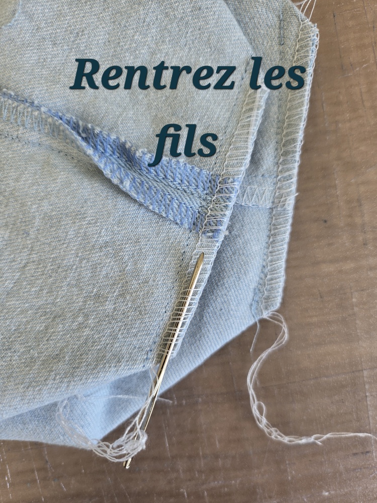 Rentrer les fil de couture du pochon